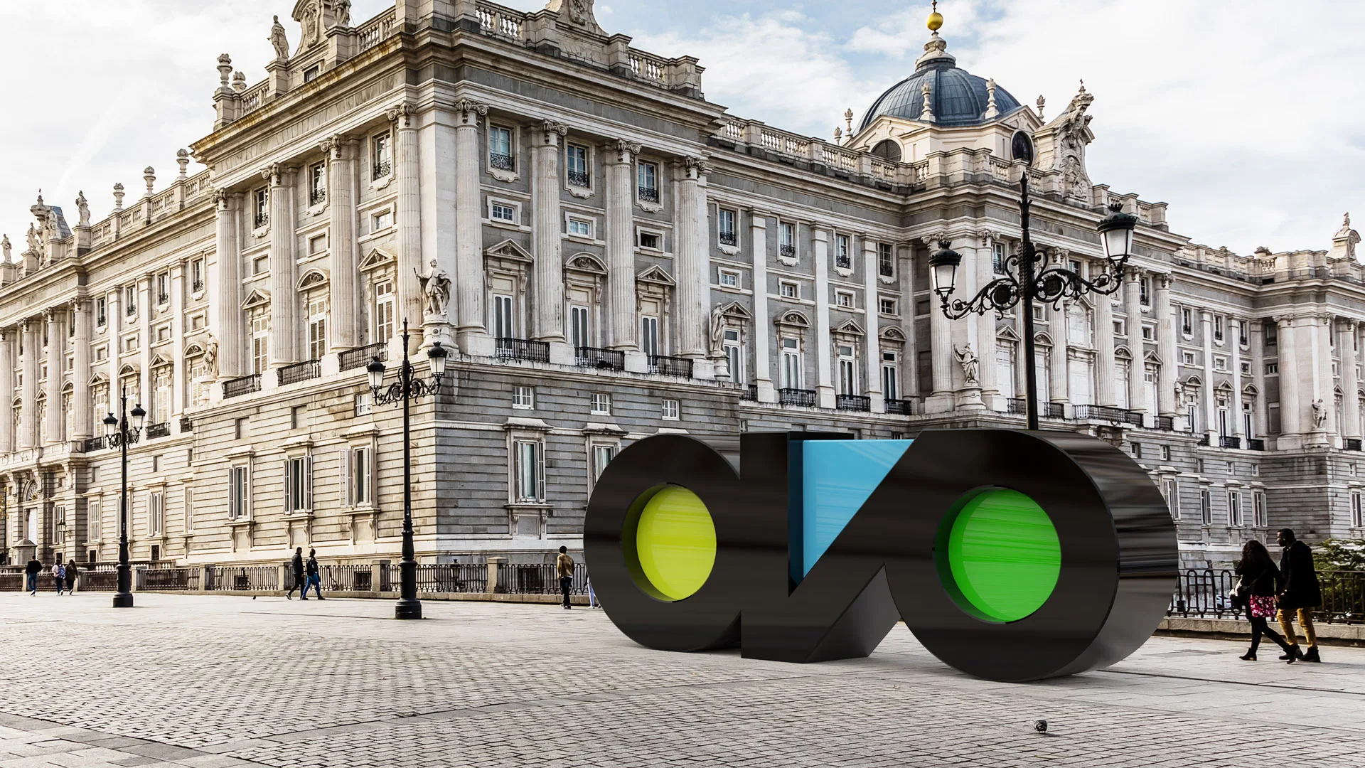 Ovo Solutions — large 3D Ovo logo sculpture in front of a historic palace