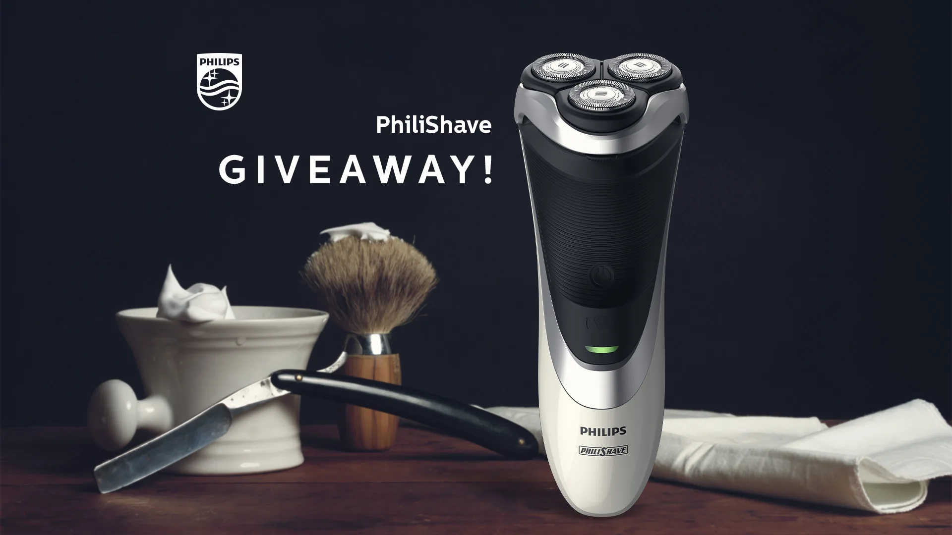 Philips — PhiliShave giveaway social post with an electric shaver beside a shaving brush and razor