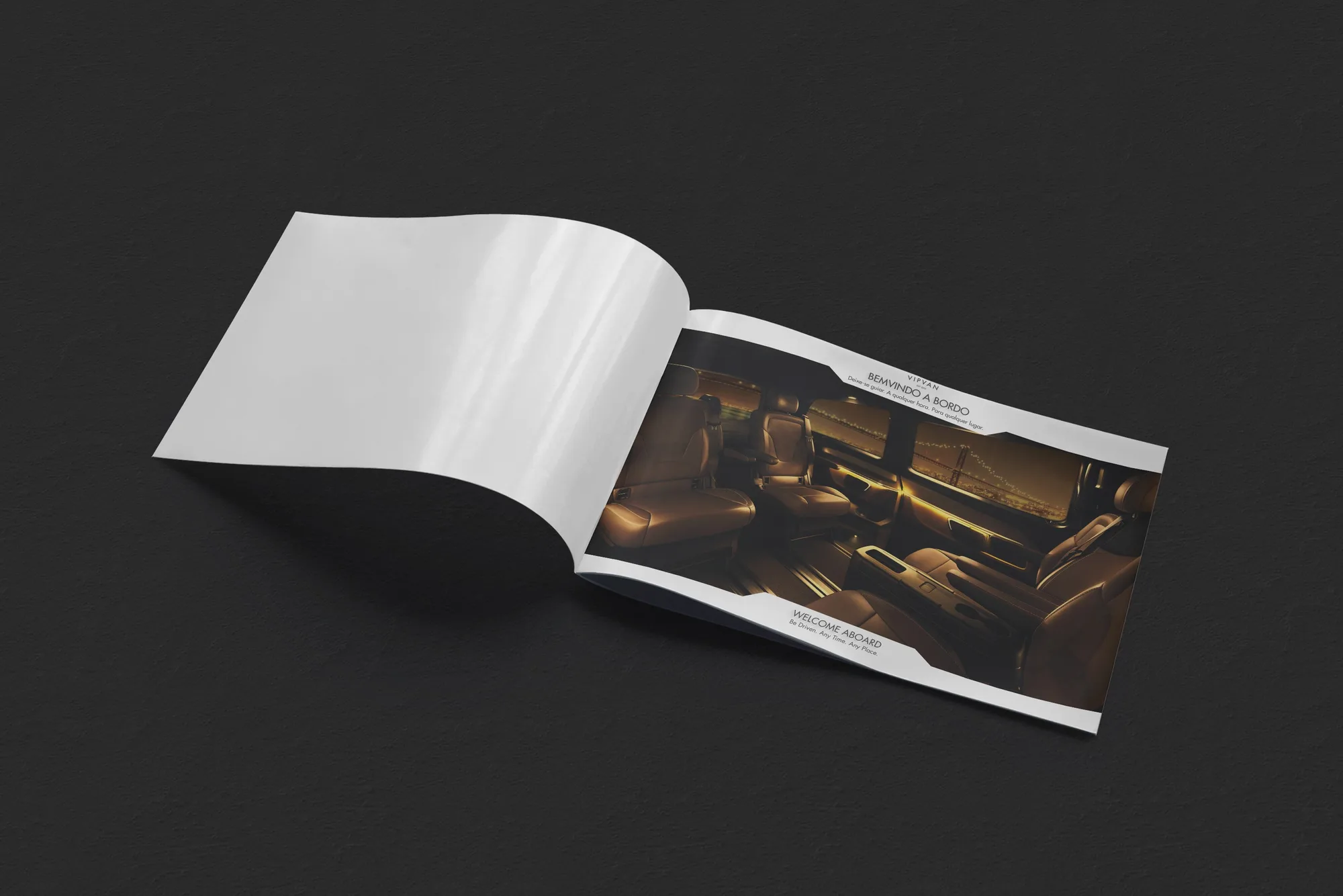 VipVan: open brochure on the Bem-vindo a bordo spread, a warm-lit van interior
