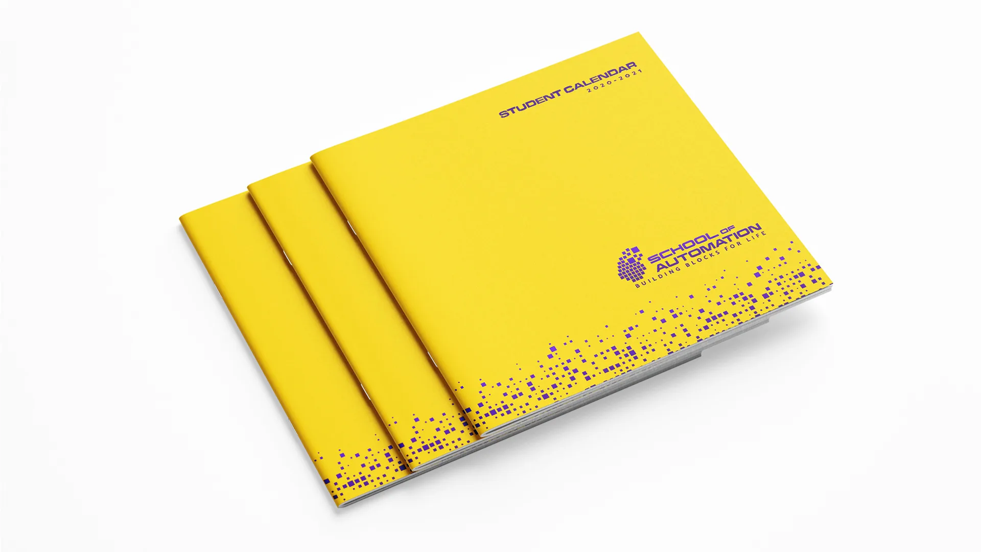 SOA – School of Automation — stack of yellow Student Calendar booklets with purple pixel pattern