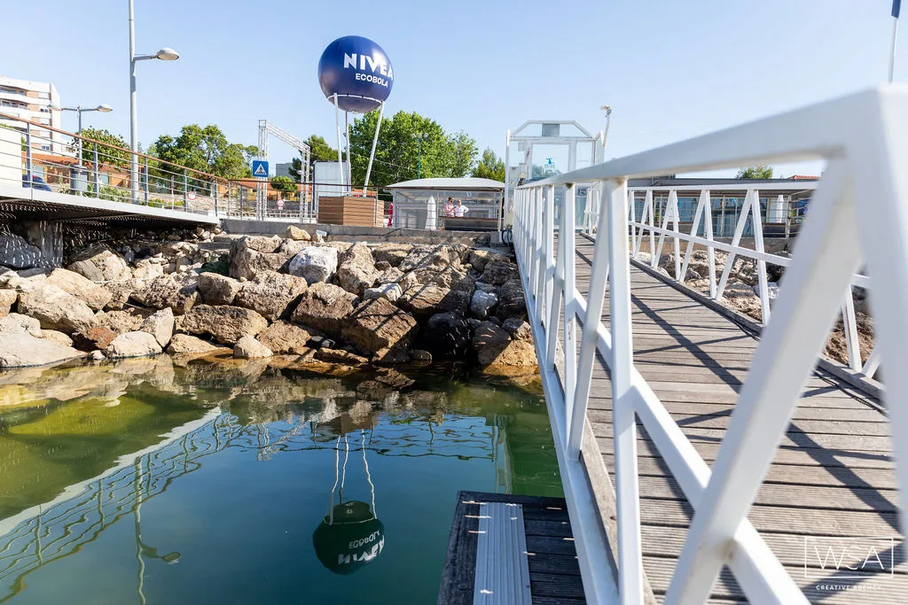 EcoBola — installed NIVEA Ecobola beside a waterfront pier and rocky shoreline