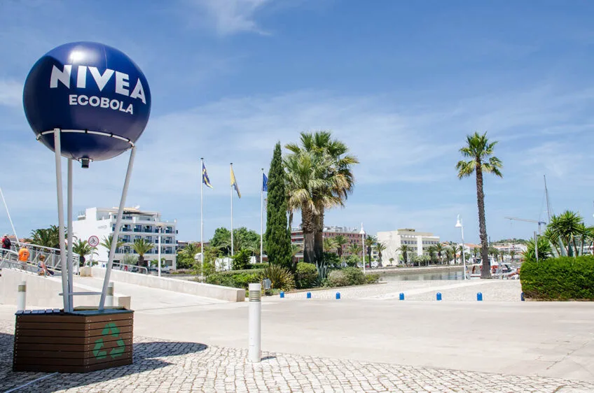 EcoBola — installed NIVEA Ecobola on a paved seafront promenade with palm trees