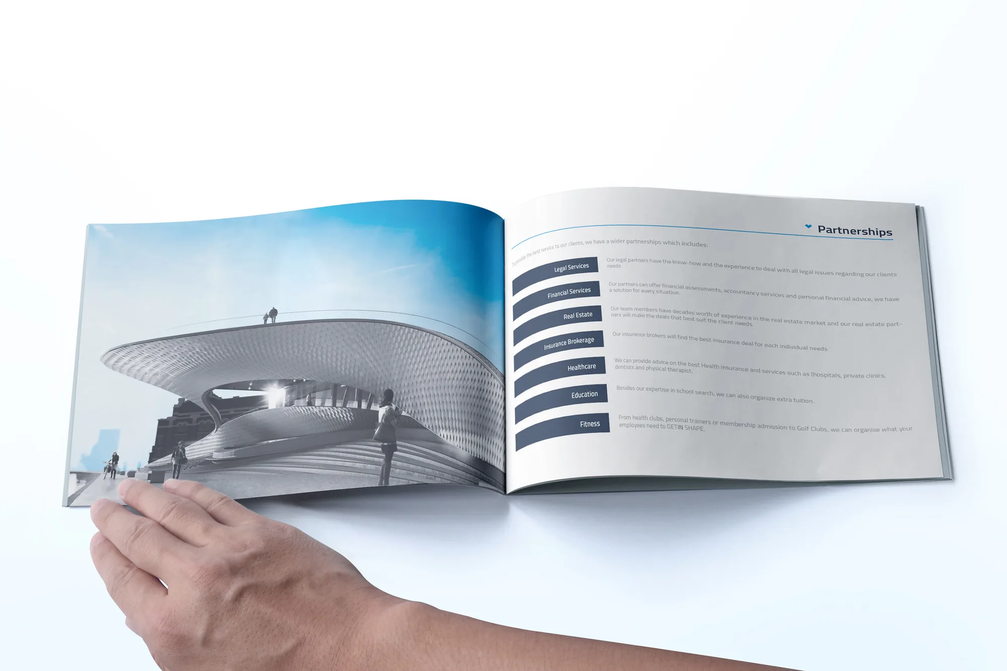 GETiN — open brochure spread with modern architecture photo and Partnerships service list
