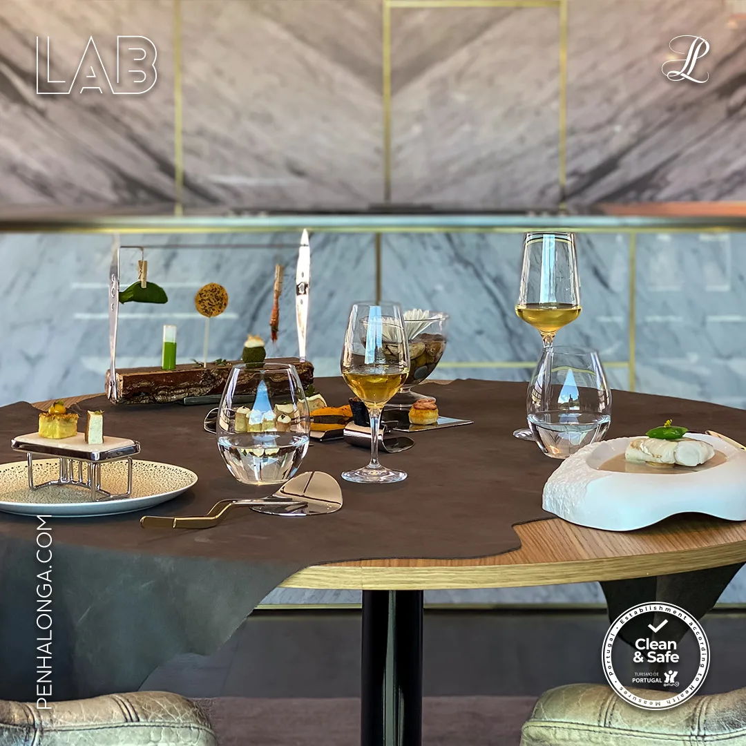 Penha Longa Resort — LAB restaurant social post of a table set with tasting dishes and wine