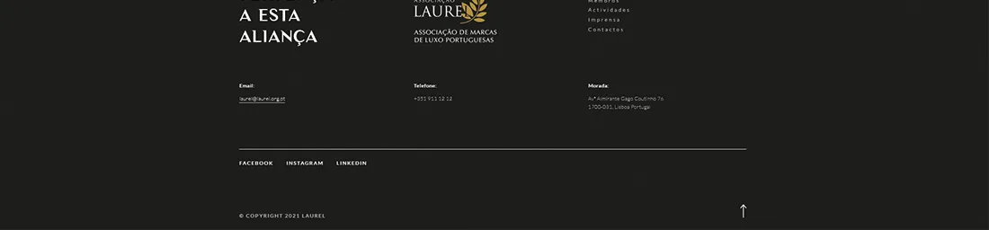 Laurel website — dark footer with contact details, social links and back-to-top arrow