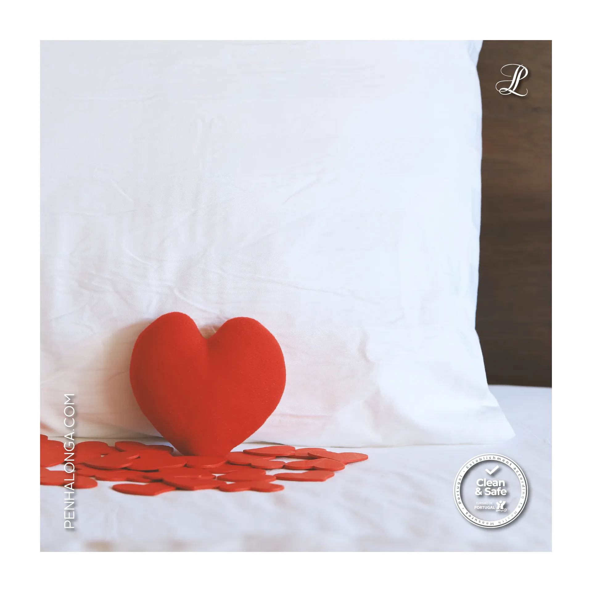 Penha Longa Resort — social post of a red heart cushion and scattered paper hearts on a white bed
