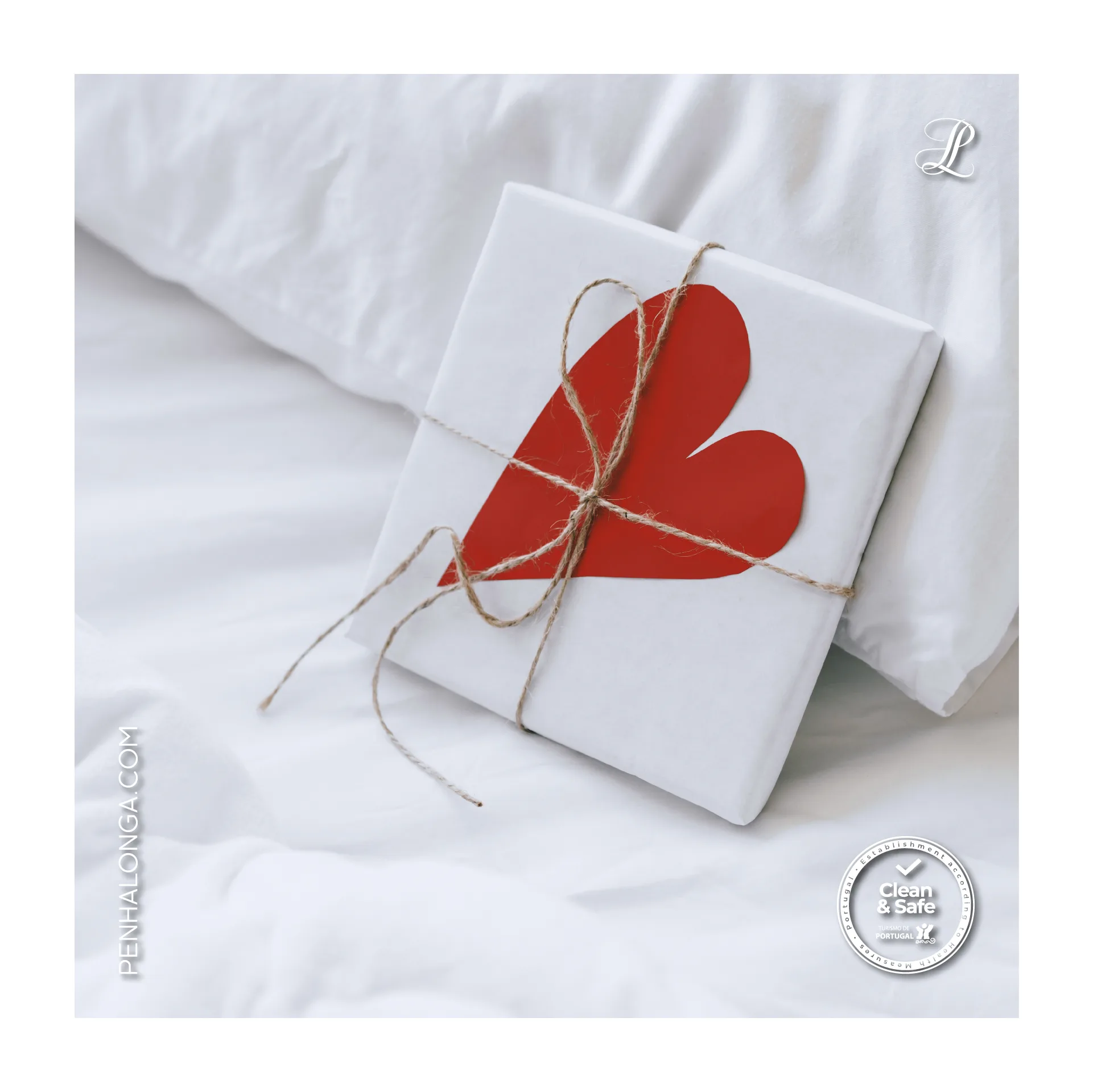 Penha Longa Resort — social post of a white gift tied with twine and a red paper heart on bed linen
